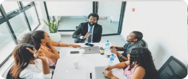 People working together around a meeting table